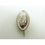 A Victorian morning brooch set with a painted ivory plaque depicting a woman with a harp, 2.4 x 1.