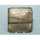 A white metal spring loaded cigarette case marked sterling silver,