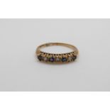 A 9ct gold ring set with diamonds and sapphires (size P/Q)
