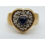 An 9ct gold ring set with a heart shaped sapphire surrounded by diamonds (size M)