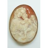 A 9ct gold pendant/ brooch set with a large cameo depicting a religious scene