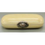 A 19thC ivory purse with white metal mounts and four division silk interior,