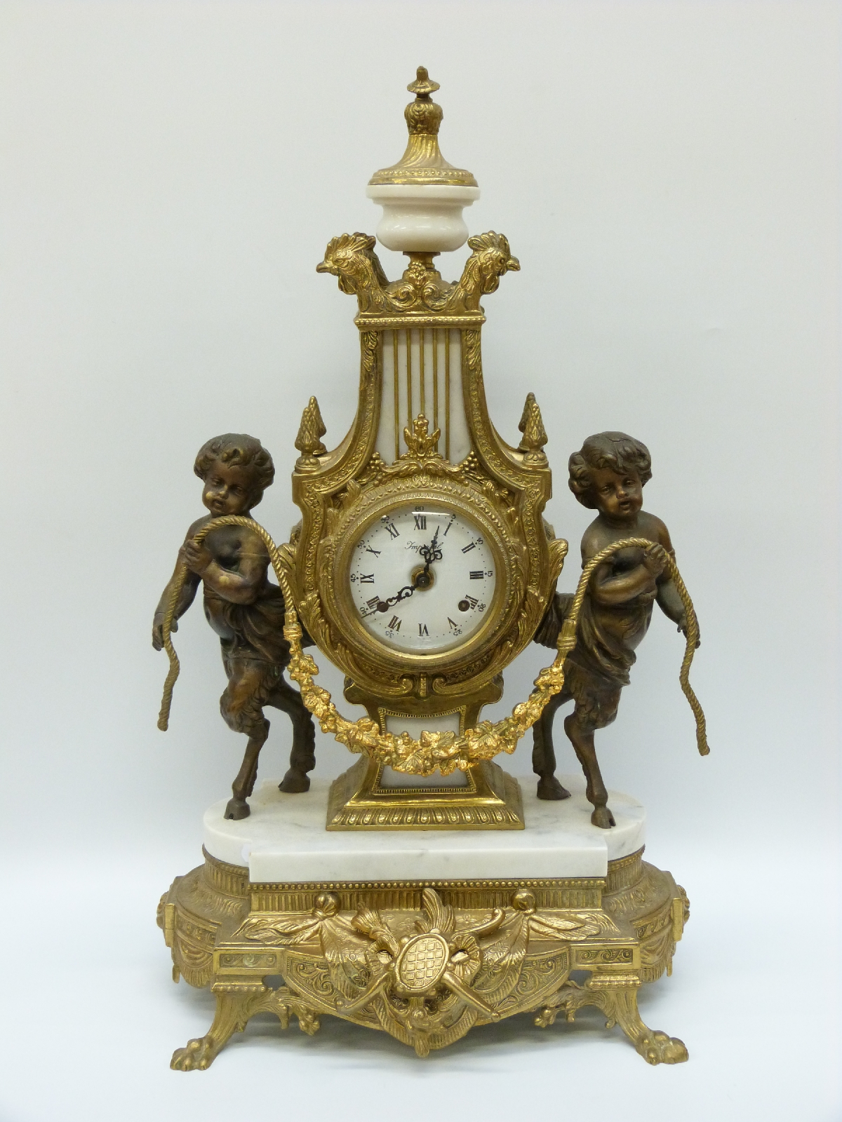 An ormolu and marble French style clock garniture, the German movement striking on a gong, - Image 2 of 3
