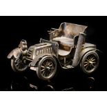 An Edward VII novelty hallmarked silver table lighter formed as a veteran car,