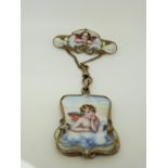 An Art Nouveau brooch set with enamel depicting cherubs with a drop section opening to reveal a