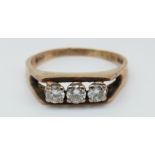 A 9ct gold ring set with three diamonds, total 0.