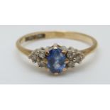 A 9ct gold ring set with an oval cut sapphire of approximately 0.