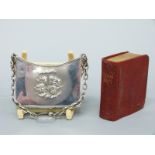 A hallmarked silver bag or book holder containing a miniature hymn book,