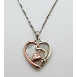 A 9ct gold and silver Clogau pendant in the shape of a heart set with mother of pearl