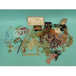 A collection of costume jewellery to include Art Deco earrings, beads,