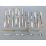 A set of six cake knives and forks with hallmarked silver ferrules,