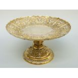 A Victorian silver gilt hallmarked silver tazza with embossed floral and fruit decoration,