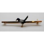 A Victorian brooch in the form of a magpie set with enamel, 5cm, 4.