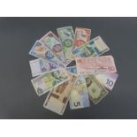 A small collection of bank notes to include Canada 50 dollars, Trinidad and Tobago, Germany, Jersey,