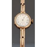 9ct gold ladies wristwatch with subsidiary seconds dial, inset Roman numerals,