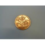 An 1875 gold full sovereign,