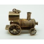 A 9ct gold charm or pendant in the form of a train, 5.