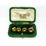 A set of three 9ct gold studs (2.55g) and a 15ct gold stud (0.