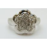 A 14ct white gold ring set with diamonds in a cluster,