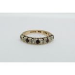 A 9ct gold half eternity ring set with diamonds and rubies, 3.