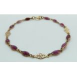 A 9ct gold bracelet set with rubies