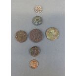 A cache of ancient coins to include Roman etc, and a Middle Eastern silver example, seven in all,