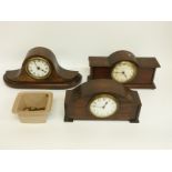 Three c1920's mantel clocks in oak cases, two with barley twist style decoration,