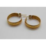 A pair of yellow metal hoop earrings, 3.