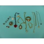 A collection of costume jewellery to include silver ring, a Monet pendant,