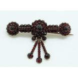 A Victorian brooch set with Bohemian cut garnets,