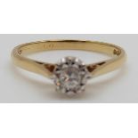 An 18ct gold ring set with a diamond of approximately 0.14ct, 2.