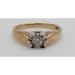 A 9ct gold ring set with a diamond of approximately 0.