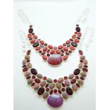 Two silver necklaces set with faux garnets and coral