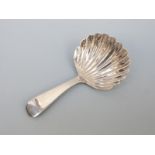 A George III hallmarked silver tea caddy spoon of shell form London 1815,