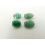 Four oval cut emeralds the largest approximately 1.