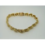 A 14ct gold bracelet with textured decoration, 13.