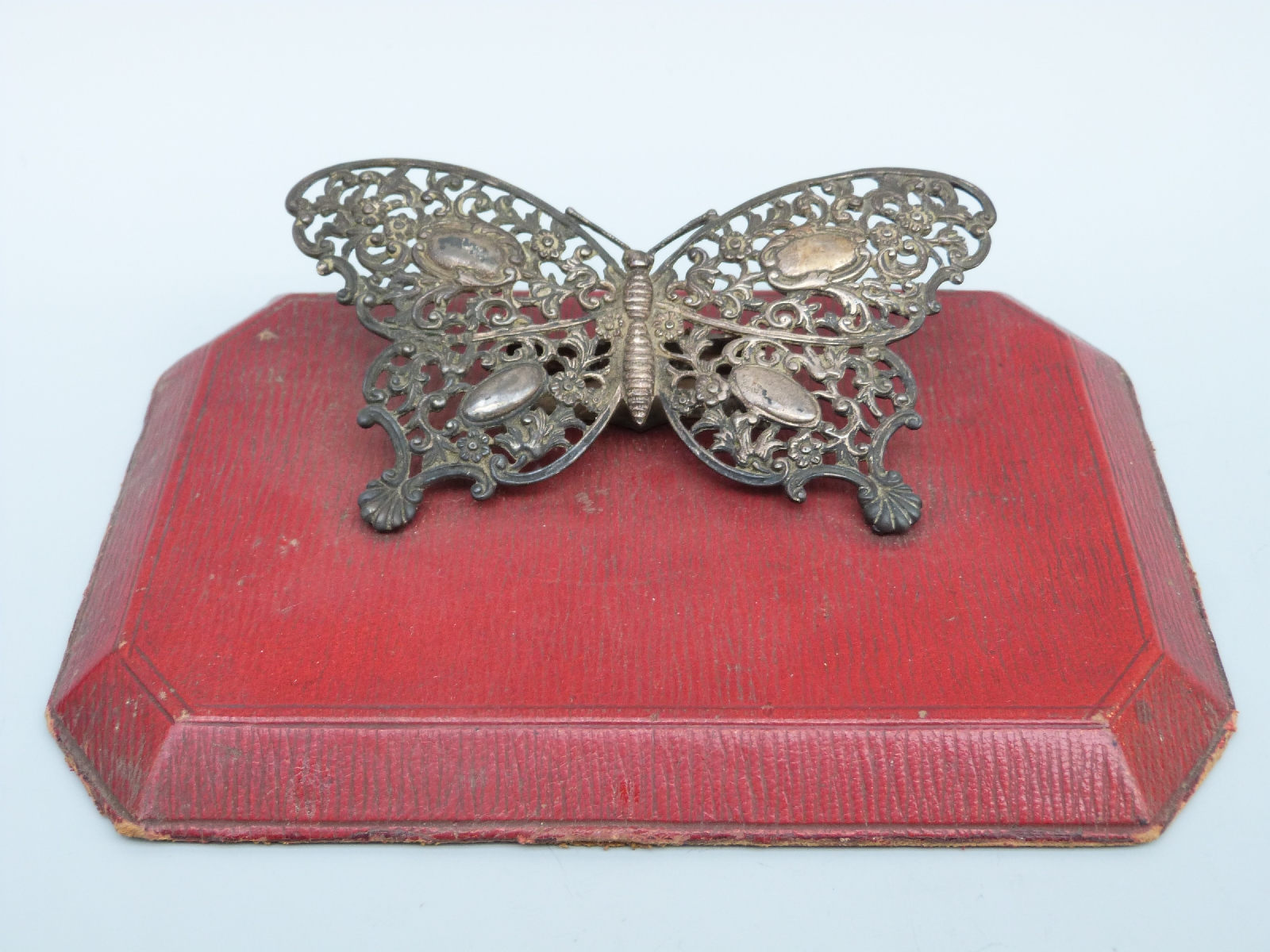 A Victorian hallmarked silver novelty desk paperclip formed as a butterfly,