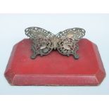 A Victorian hallmarked silver novelty desk paperclip formed as a butterfly,