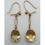 A pair of 9ct gold earrings set with citrines