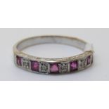 An 18ct white gold ring set with square rubies and diamonds (size N)