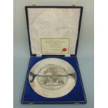 A boxed limited edition hallmarked silver limited edition (311/750) collectors plate,