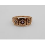 A Victorian 15ct gold ring set with an amethyst and seed pearls, 1.