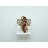 An Eastern gold ring set with rubies and point cut diamonds, 4.