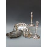 Two swing-handled bowls, one silver plated, the other pewter, a pair of candlesticks,