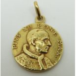 An 18ct gold pendant in the form of a coin, 3.