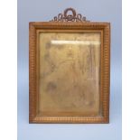 A late 19thC gilt photograph/picture frame with ornate finial and optional easel back or suspension