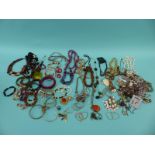 A large quantity of costume jewellery including beads,