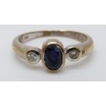 A 9ct gold ring set with an oval sapphire of approximately 0.