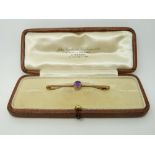 A 9ct gold brooch set with an amethyst,