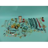 A collection of costume jewellery including compacts, beads, bangles, agate pendants, antique boxes,